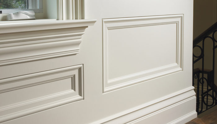 wainscoting wood paneling close up around window frame showing wood trim detail